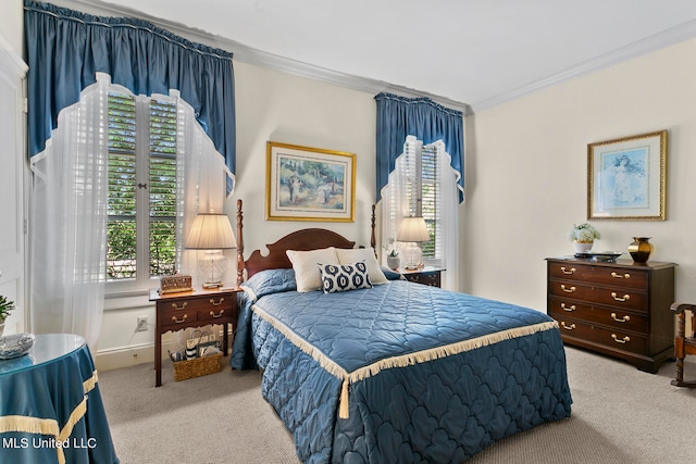 bedroom featuring crown molding and light carpet