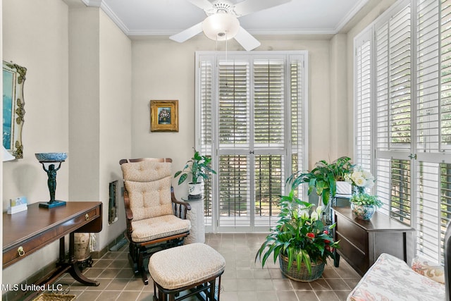 living area featuring crown molding, a healthy amount of sunlight, and ceiling fan