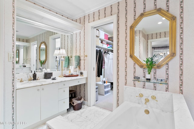 bathroom featuring vanity, crown molding, a healthy amount of sunlight, and a bath