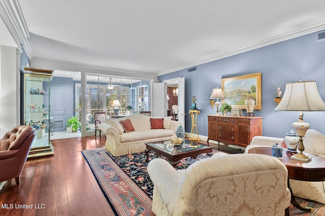 living room featuring dark wood-type flooring and crown molding