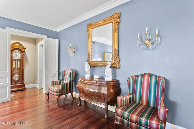 living area with ornamental molding and hardwood / wood-style flooring