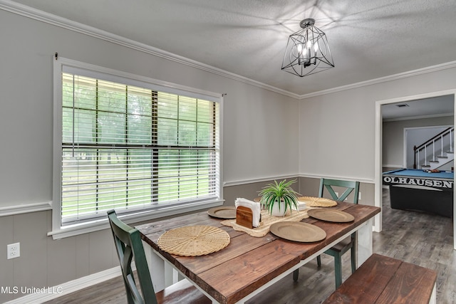 1597 Old Lake Rd, Brandon, MS 39042 - dining area featuring wood finished floors, a chandelier, crown molding, and stairway