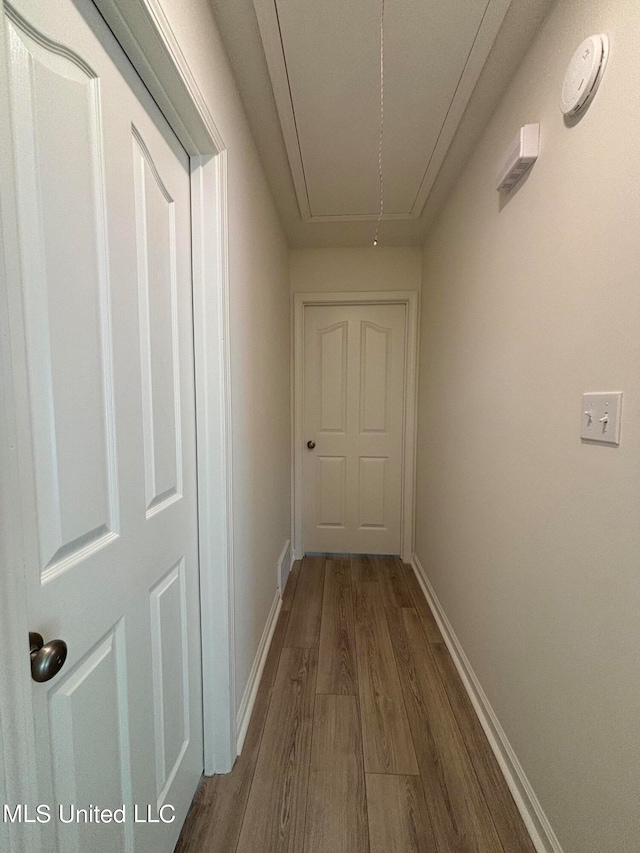 corridor featuring hardwood / wood-style floors