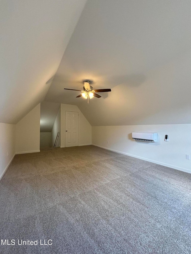 bonus room with ceiling fan, carpet, vaulted ceiling, and a wall unit AC