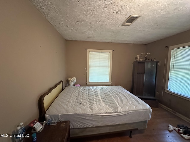4513 Lawrence Hazel Rd, Lawrence, MS 39336 - carpeted bedroom featuring a textured ceiling and baseboards