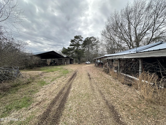 4513 Lawrence Hazel Rd, Lawrence, MS 39336 - view of dirt / gravel driveway featuring an outbuilding
