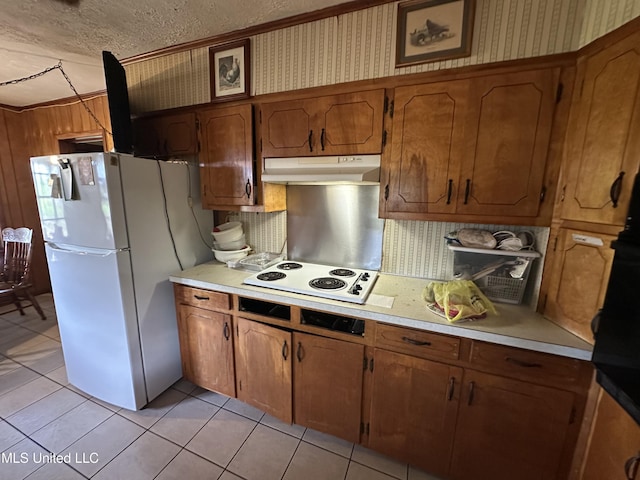 4513 Lawrence Hazel Rd, Lawrence, MS 39336 - kitchen featuring under cabinet range hood, white appliances, light countertops, tasteful backsplash, and a textured ceiling