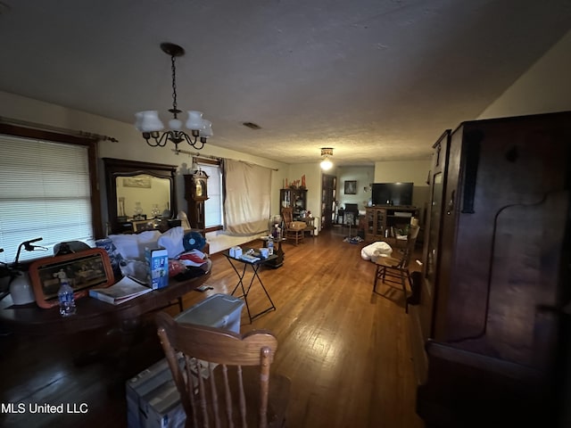 4513 Lawrence Hazel Rd, Lawrence, MS 39336 - living room featuring wood finished floors and a chandelier