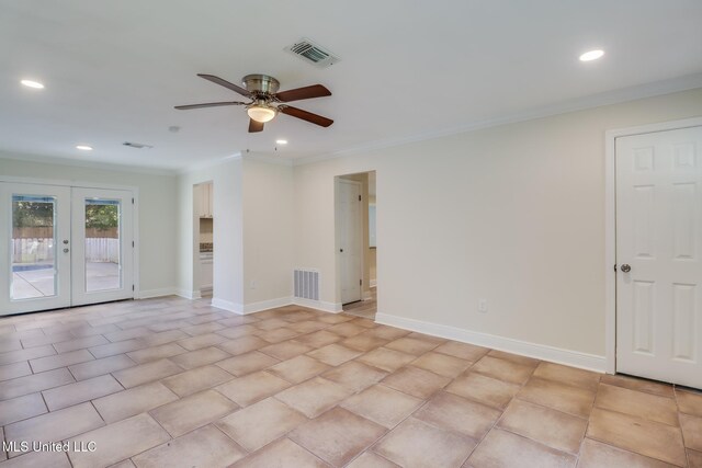 tiled empty room featuring ceiling fan, ornamental molding, and french doors