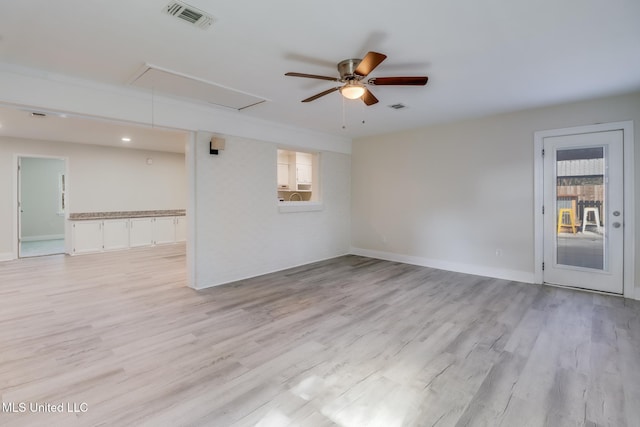 spare room featuring ceiling fan and light wood-type flooring