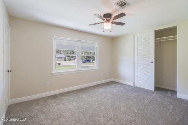 unfurnished bedroom featuring carpet flooring, a closet, and ceiling fan