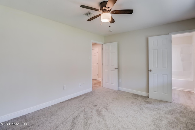 unfurnished bedroom with ceiling fan and light carpet