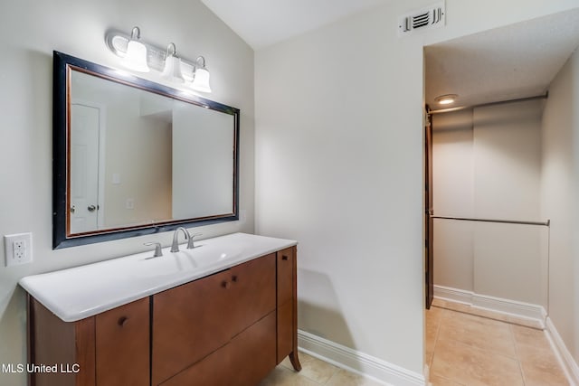 bathroom featuring tile patterned floors and vanity