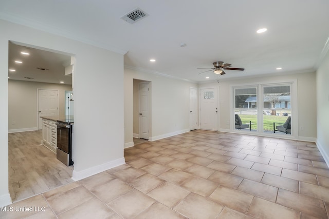 empty room with light hardwood / wood-style flooring, ceiling fan, and crown molding