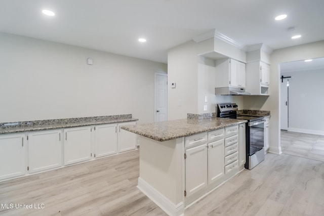 kitchen with kitchen peninsula, light wood-type flooring, light stone counters, white cabinets, and stainless steel range with electric cooktop