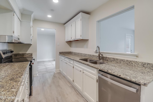 kitchen featuring white cabinets, appliances with stainless steel finishes, light wood-type flooring, and sink