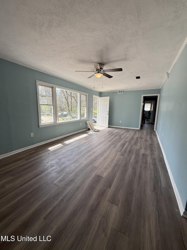 unfurnished living room with dark wood-style floors, a textured ceiling, baseboards, and ceiling fan