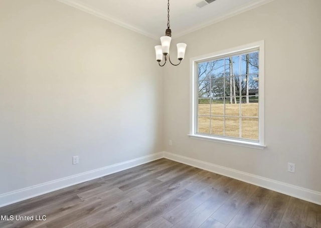 3752 Roland Dr, Southaven, MS 38672 - unfurnished room featuring a chandelier, ornamental molding, baseboards, and dark wood-style flooring