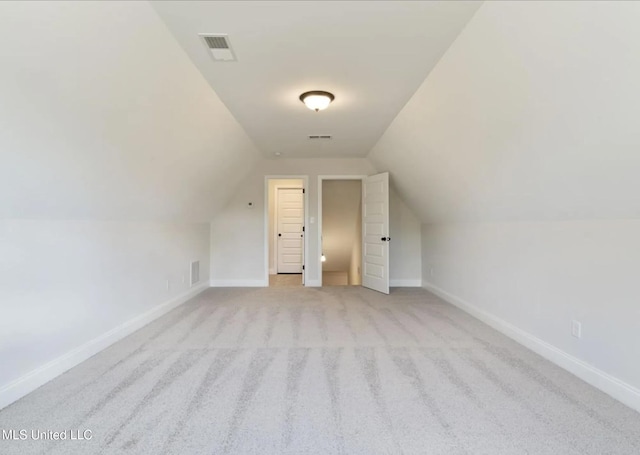 3752 Roland Dr, Southaven, MS 38672 - additional living space featuring baseboards, light carpet, and lofted ceiling