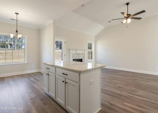 3752 Roland Dr, Southaven, MS 38672 - kitchen featuring open floor plan, a chandelier, baseboards, ornamental molding, and vaulted ceiling