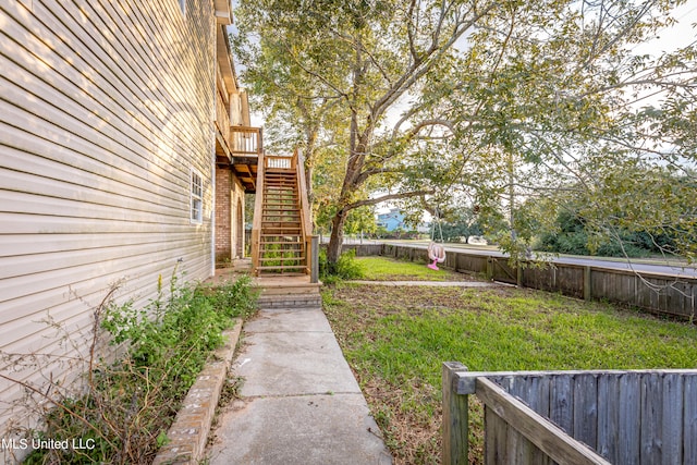 view of yard with a wooden deck