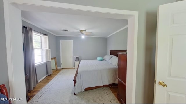 269 Weecama Dr, Ferriday, LA 71334 - bedroom with light wood-style floors, visible vents, and ornamental molding