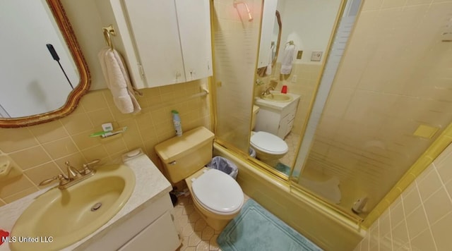 269 Weecama Dr, Ferriday, LA 71334 - bathroom featuring toilet, tile walls, a stall shower, tile patterned flooring, and vanity