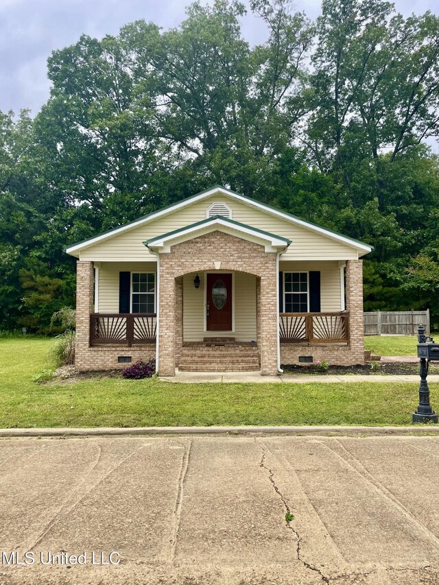 52 Alpine Dr, Starkville, MS 39759 - ranch-style home with covered porch, brick siding, and a front yard