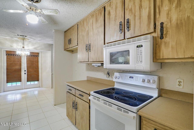 kitchen featuring a textured ceiling, light tile patterned flooring, ceiling fan with notable chandelier, decorative light fixtures, and white appliances