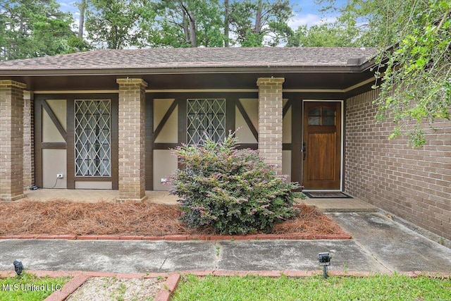 doorway to property featuring a porch