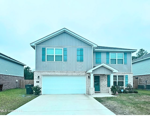 view of front facade featuring a front lawn and a garage