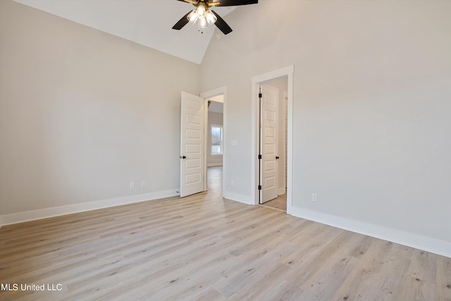 unfurnished bedroom featuring light hardwood / wood-style floors, high vaulted ceiling, and ceiling fan