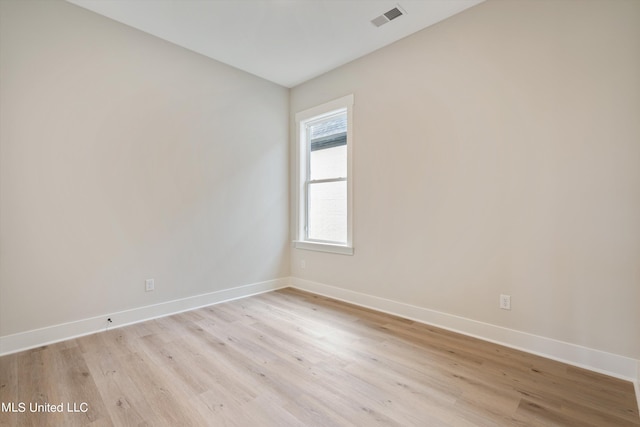 unfurnished room with light hardwood / wood-style flooring