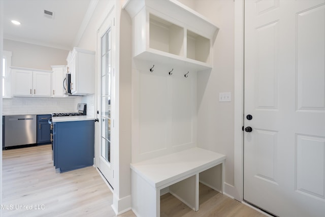 mudroom with light hardwood / wood-style flooring