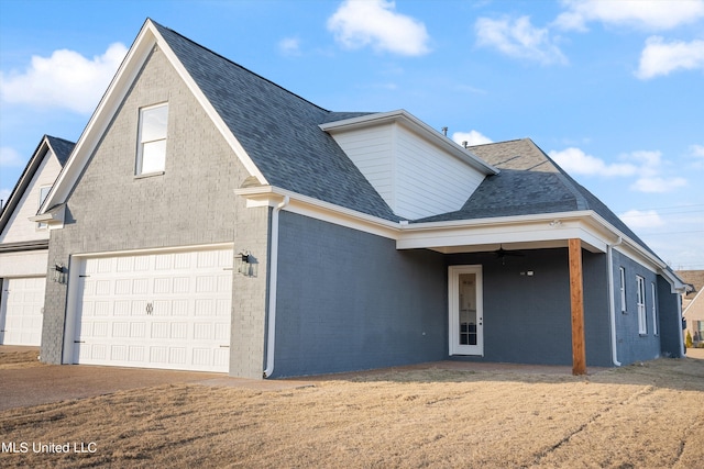 view of front property with french doors, a garage, and ceiling fan