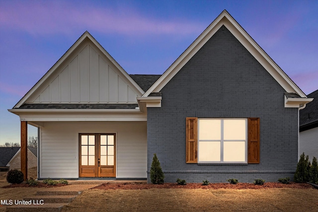 back house at dusk with french doors