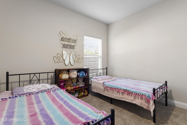 carpeted bedroom with baseboards