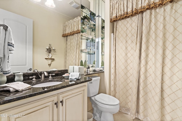 bathroom featuring vanity, toilet, and crown molding