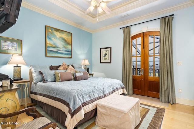 bedroom with french doors, ceiling fan, crown molding, and light hardwood / wood-style flooring