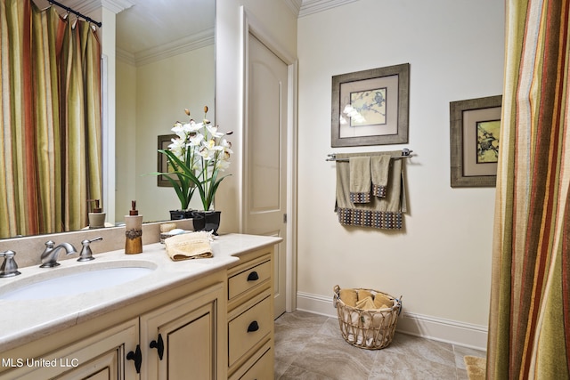 bathroom with vanity, ornamental molding, and tile patterned floors