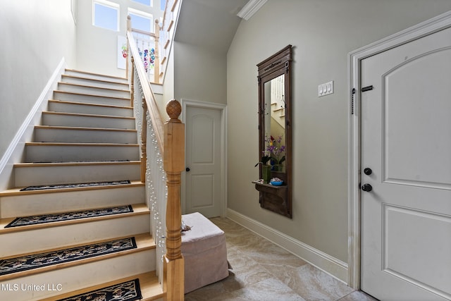 stairs featuring lofted ceiling