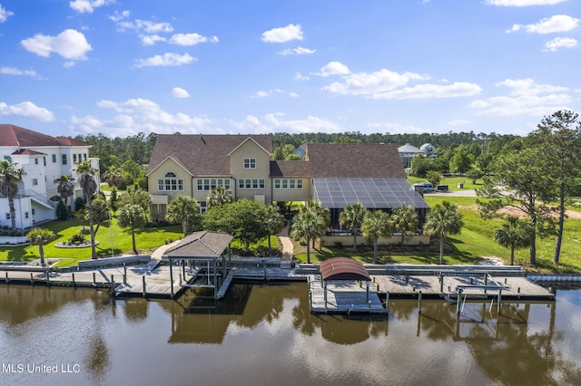 dock area featuring a yard and a water view