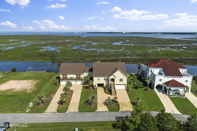 birds eye view of property with a water view