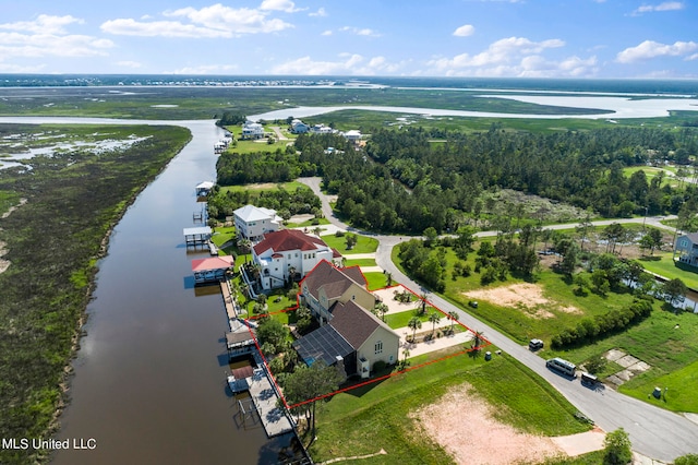 birds eye view of property featuring a water view