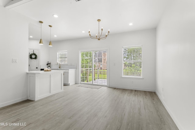 14789 Nassau Dr, Biloxi, MS 39532 - unfurnished living room featuring light wood finished floors, a chandelier, and recessed lighting