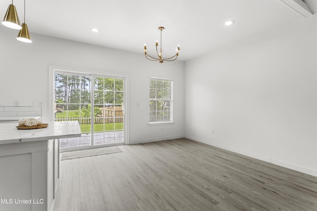 14789 Nassau Dr, Biloxi, MS 39532 - unfurnished dining area with wood finished floors, a chandelier, and recessed lighting