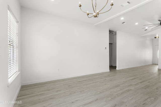 14789 Nassau Dr, Biloxi, MS 39532 - unfurnished room with a chandelier, light wood finished floors, ceiling fan, vaulted ceiling, and recessed lighting