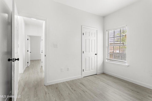 14789 Nassau Dr, Biloxi, MS 39532 - unfurnished bedroom featuring wood finished floors and baseboards