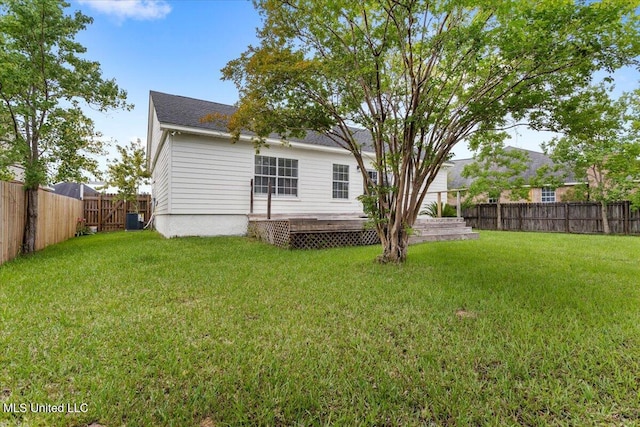 14789 Nassau Dr, Biloxi, MS 39532 - back of house featuring a fenced backyard and a wooden deck