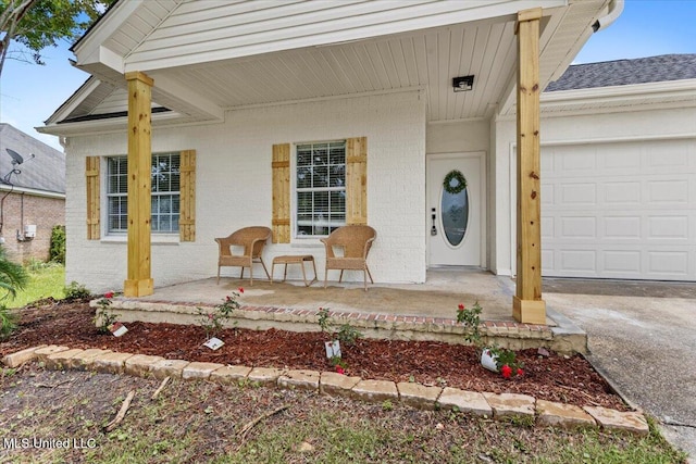 14789 Nassau Dr, Biloxi, MS 39532 - entrance to property with a porch, brick siding, an attached garage, and roof with shingles